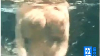 Mature with big natural tits underwater