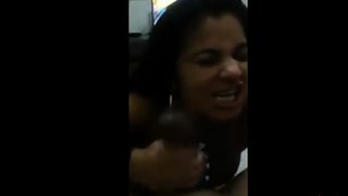 A Brazilian girl gives him a blowjob.